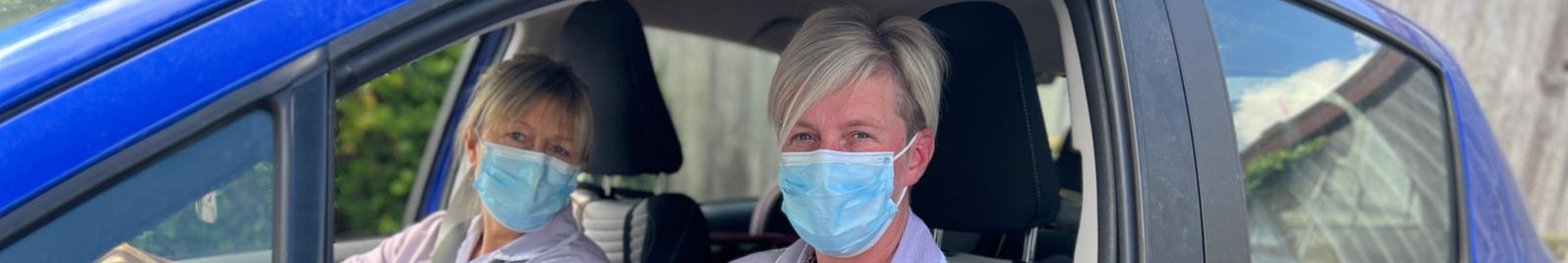 hospice-at-home-nurses-in-car-wearing-masks