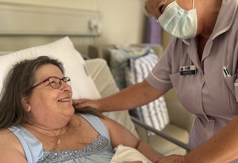 patient-sheila-and-nurse-rom-smile-at-eachother